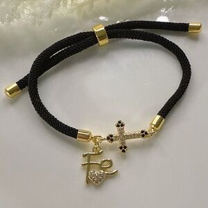 Elegant Black and Gold Bracelet with Charms